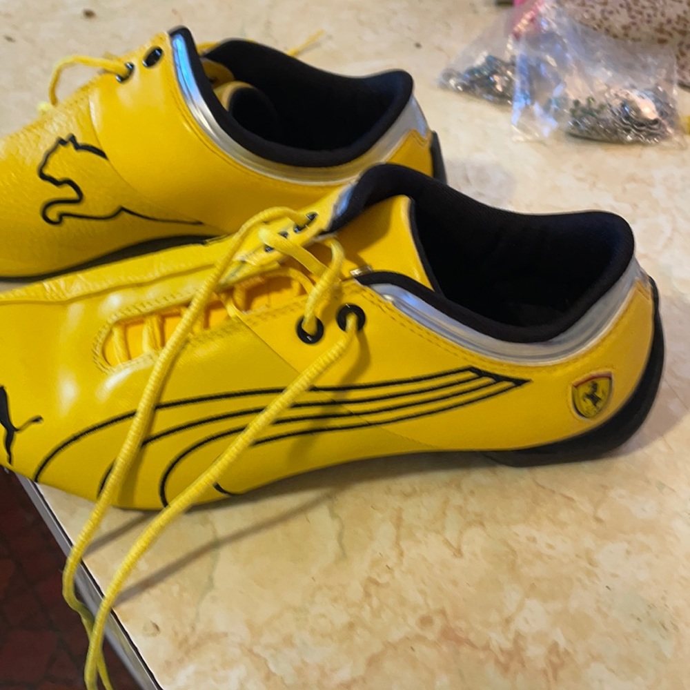 Puma yellow an black shoes